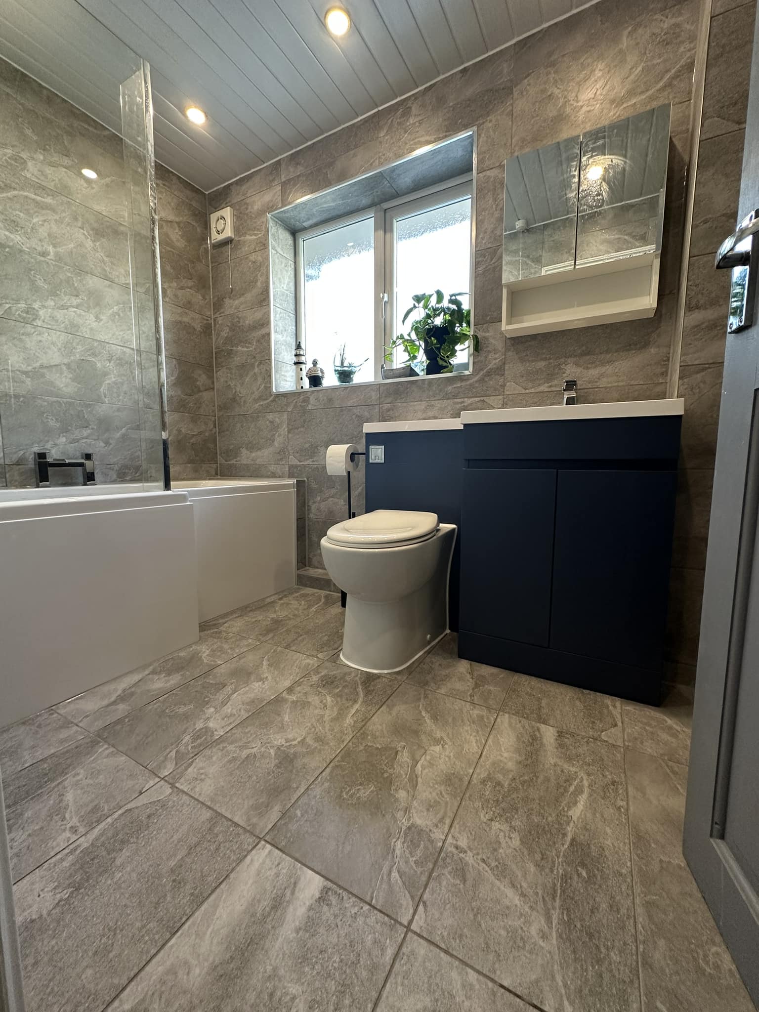 Grey marble tiled bathroom